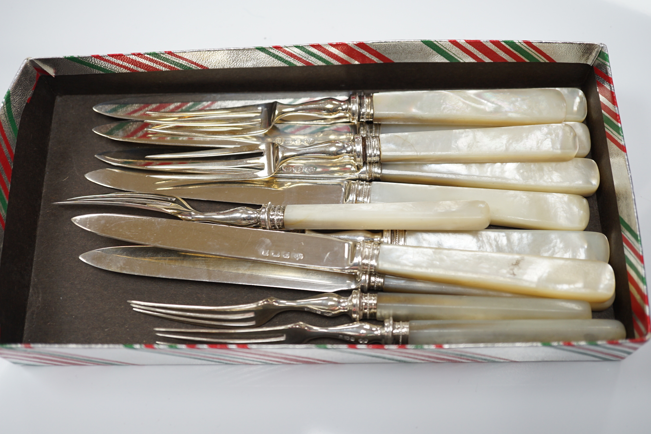 Six pairs of George V mother of pearl handled silver dessert eaters, Elkington & Co, Birmingham, 1912 and a cased set of twelve pairs of mother of pearl handled silver plated dessert eaters.